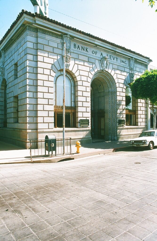 Street view of Bank of A. Levy in Renaissance-style architecture, taken in 1985.