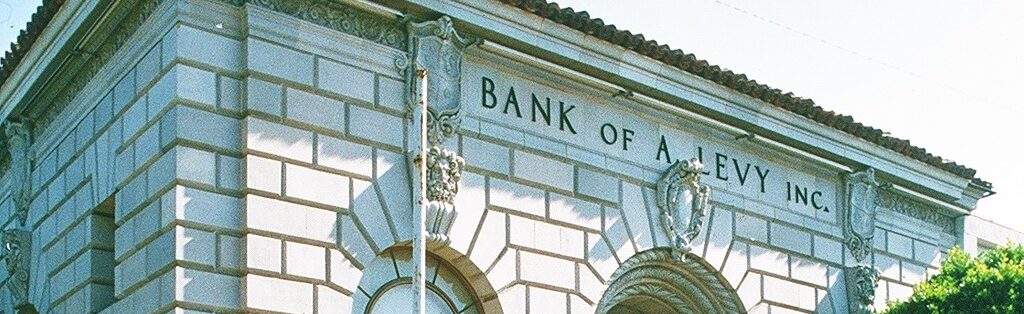 Exterior view of Bank of A. Levy in Renaissance-style architecture, captured in 1985.