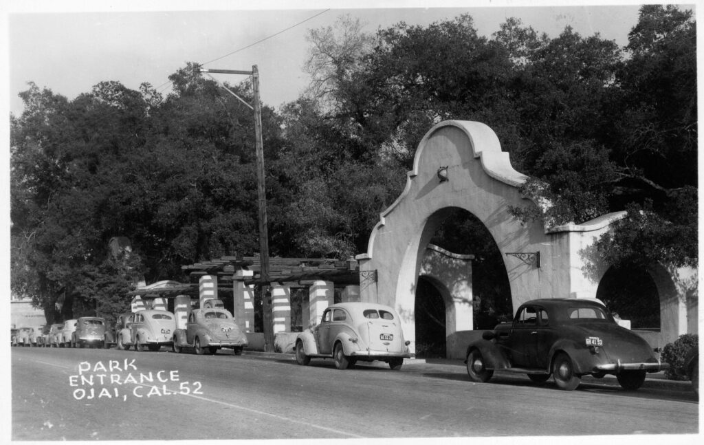 Historical photo of Libbey Park entrance with vintage cars.