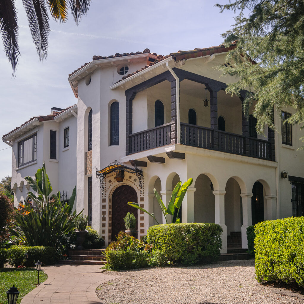 Primary façade of Acacia Mansion with arches and balcony, 2011.