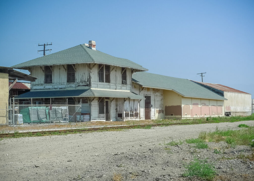 Saticoy’s Southern Pacific Railroad Depot in 2021, showing the structure before removal of rear non-historic addition, surrounded by a dirt lot.